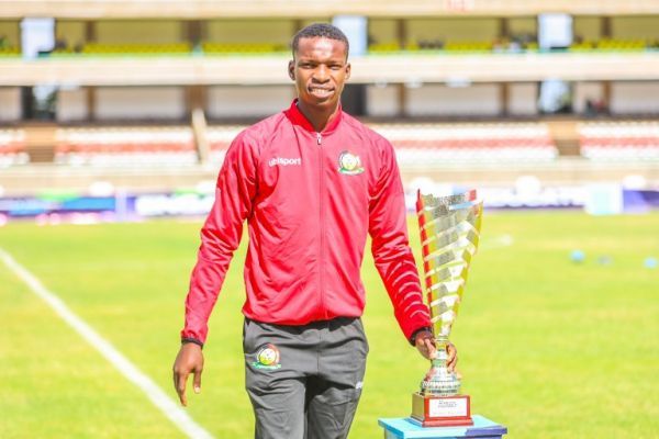 Amos Wanjala presenting the CECAFA U15 trophy. Photo/Courtesy