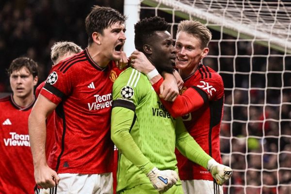 Manchester United players celebrate after Onana's penalty save. PHOTO| AFP