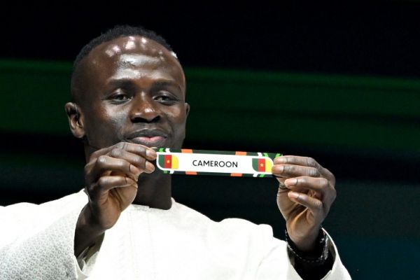 Senegal star Sadio Mane assisting in the official draw. PHOTO| AFP